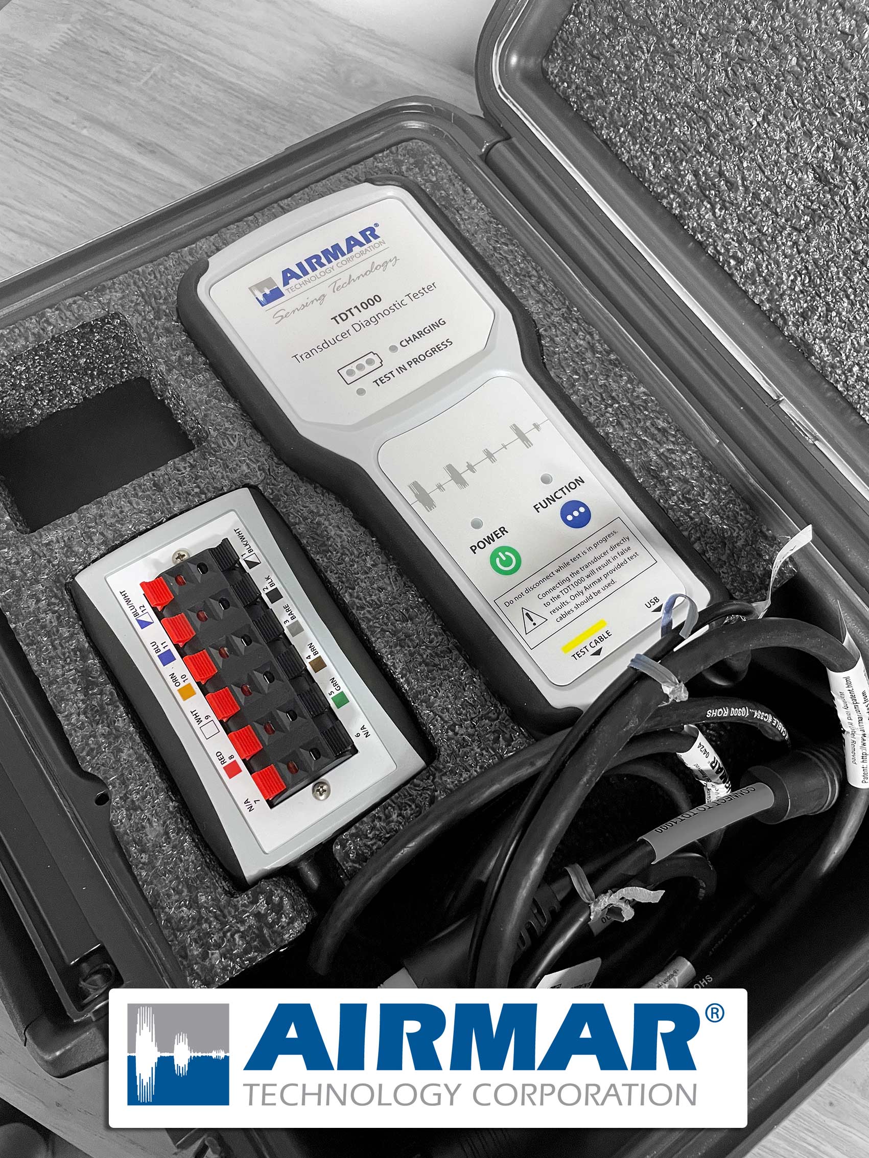 AIRMAR diagnostic tool in a protective case with visible branding.